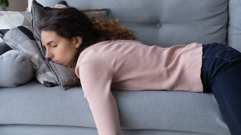 woman sleeping on sofa