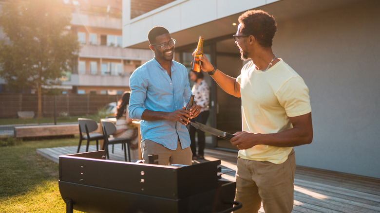 Adults laughing at barbeque