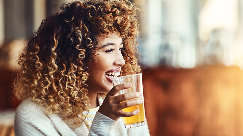 Woman enjoying a drink at the bar