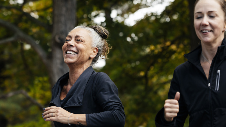 Smiling ewomen going for a jog