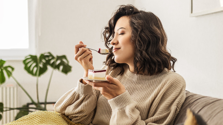 Woman enjoying a piece of cake