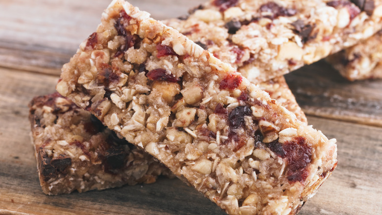 Unwrapped granola bar out on a wooden table