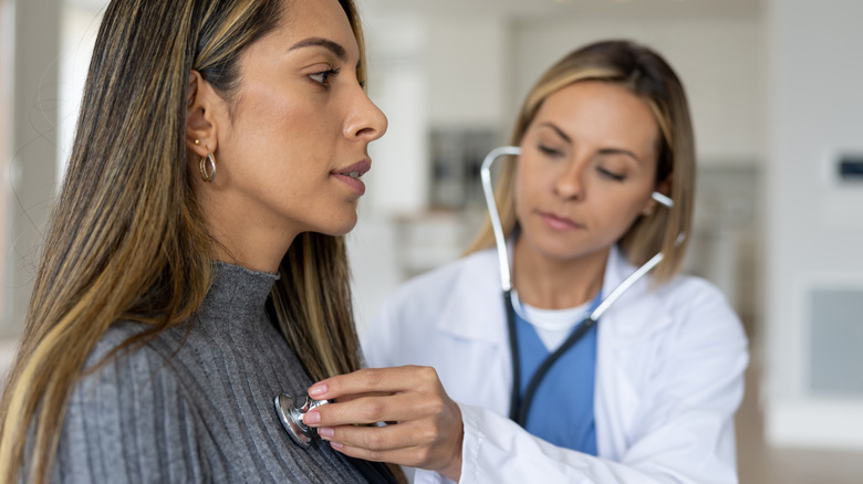 Woman gets her heart monitored at a doctor's visit