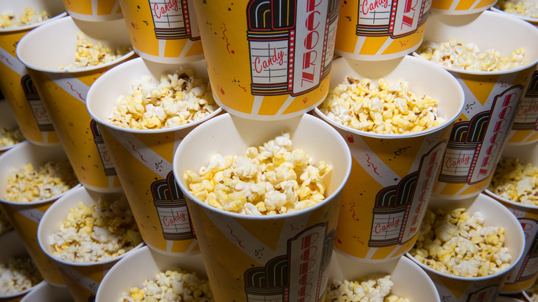 Stacks of popcorn buckets at a movie theater