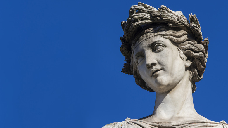 Greek statue with garland on head 