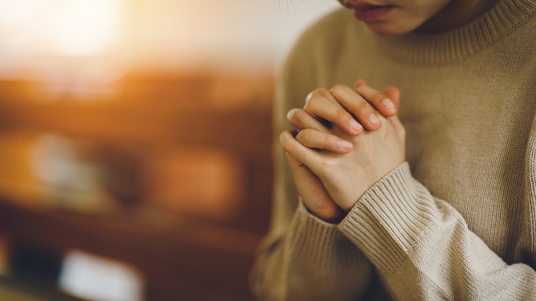 Woman in church praying 
