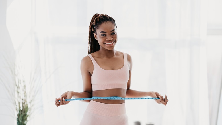 Woman measuring waist