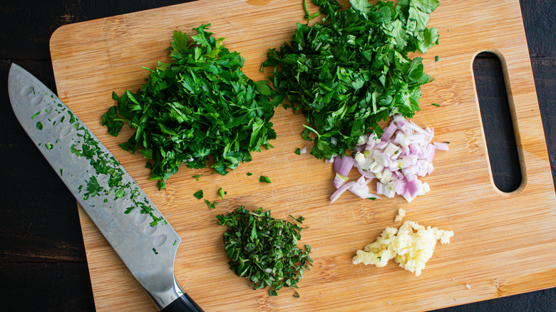 Parsley and herbs on cutting board