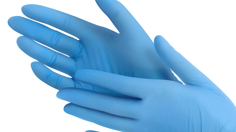 blue latex gloves with white background