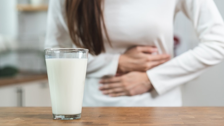 Woman with stomachache from lactose intolerance