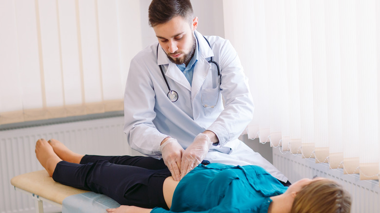 woman being examined by a gut doctor