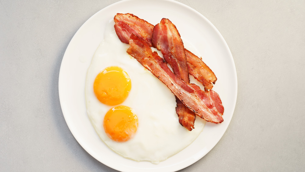 Bacon and eggs on plate