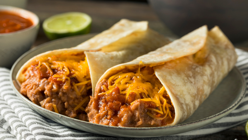 Bean and cheese burritos on a plate