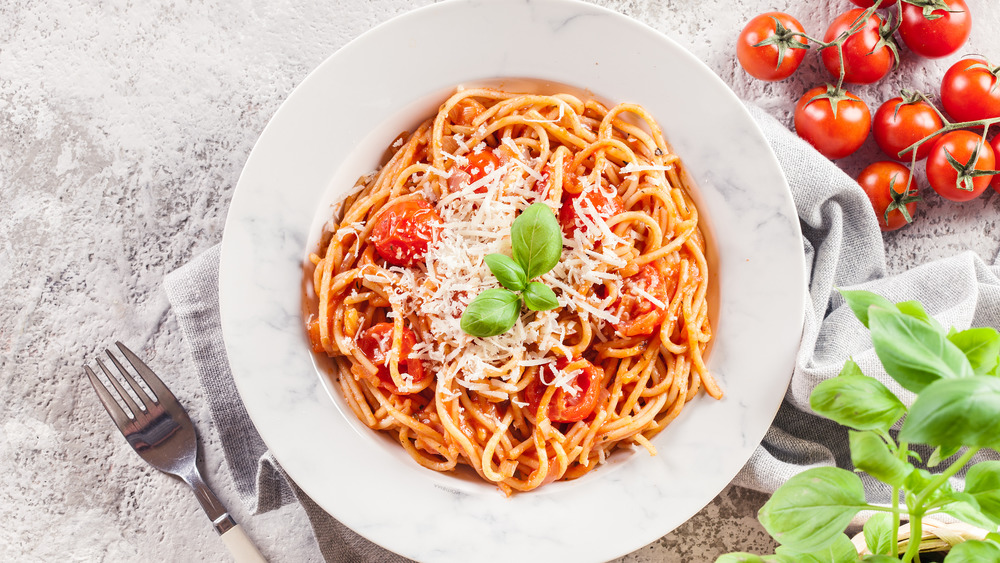 Pasta with tomato sauce and cheese on top