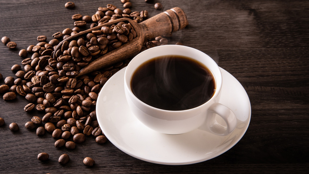 coffee beans and coffee on table