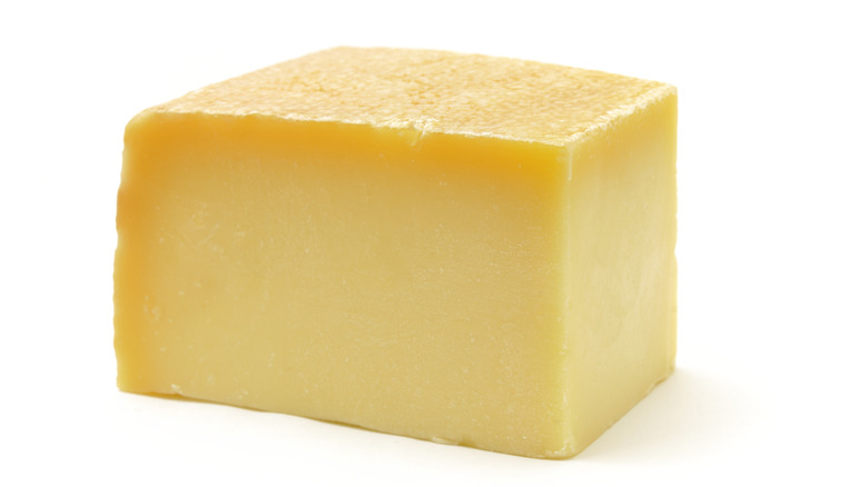 Swiss Gruyère cheese on white background