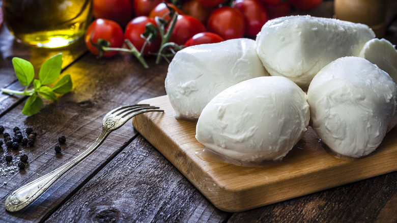 Fresh mozzarella cheese on cutting board