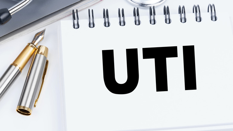 UTI spelled out on notebook