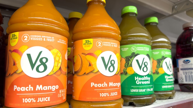 Four bottles of V8 juice blends