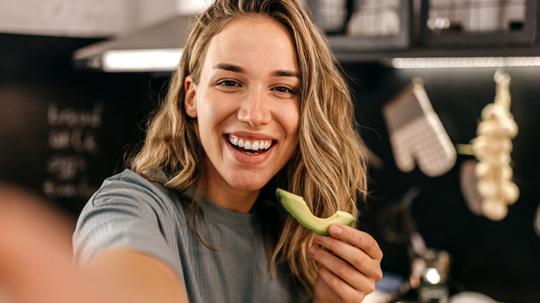 Woman with avocado