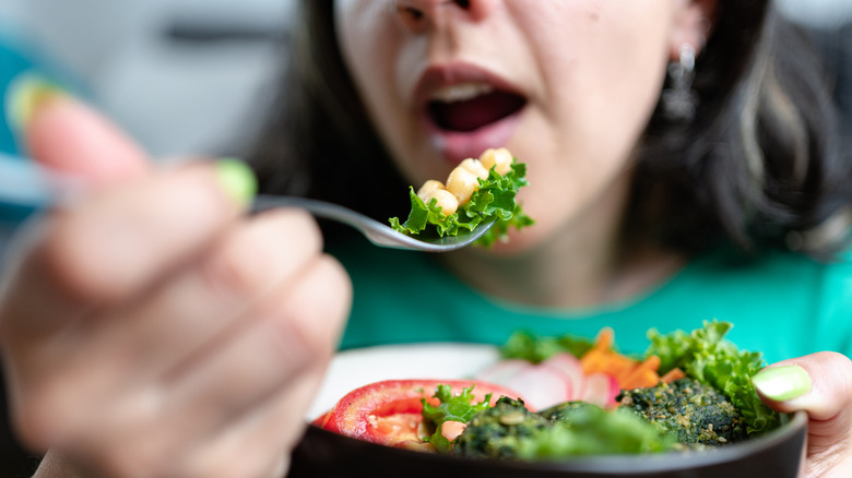 Woman eating chickpeas