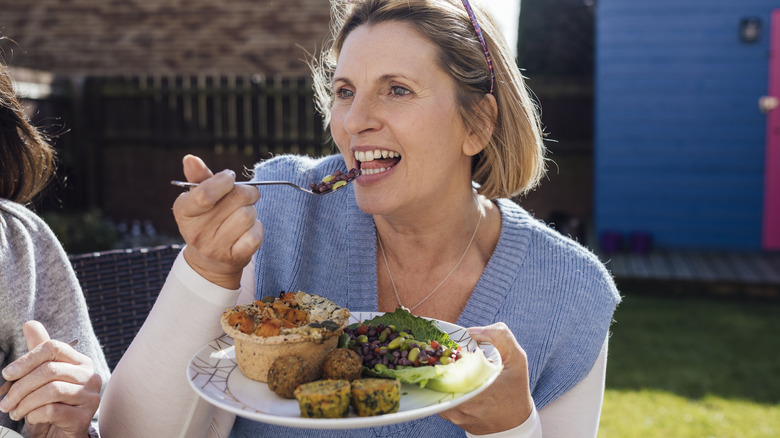 Woman eating edamame