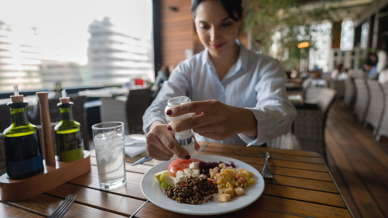 Woman eating lentils