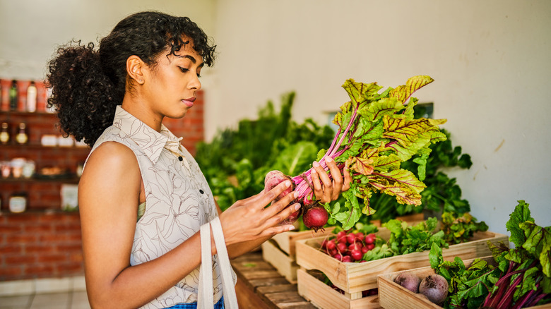 Woman shopping for fresh vegetables