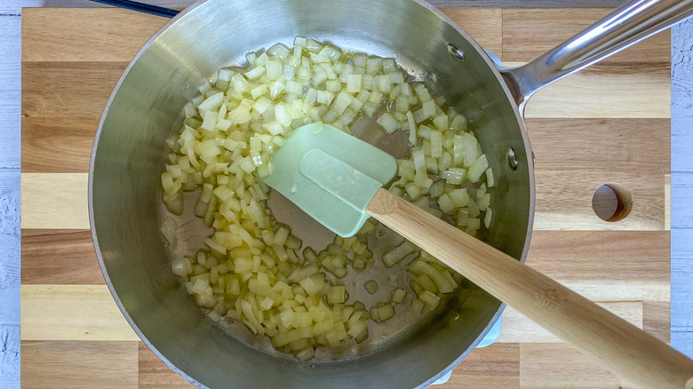 onions frying in pan