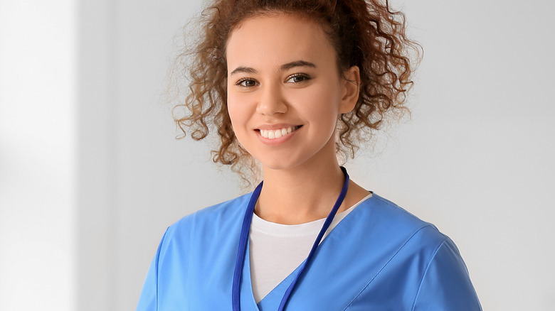 Doctor smiling in blue garb