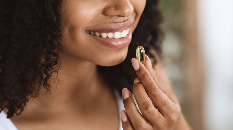 woman taking omega-3's