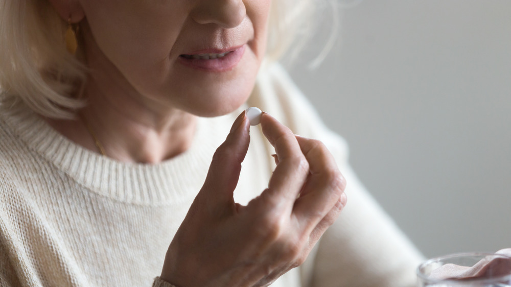 woman taking vitamins