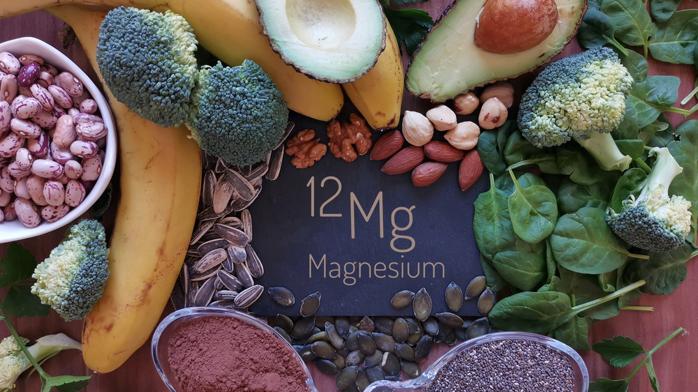 magnesium written on board, surrounded by healthy food