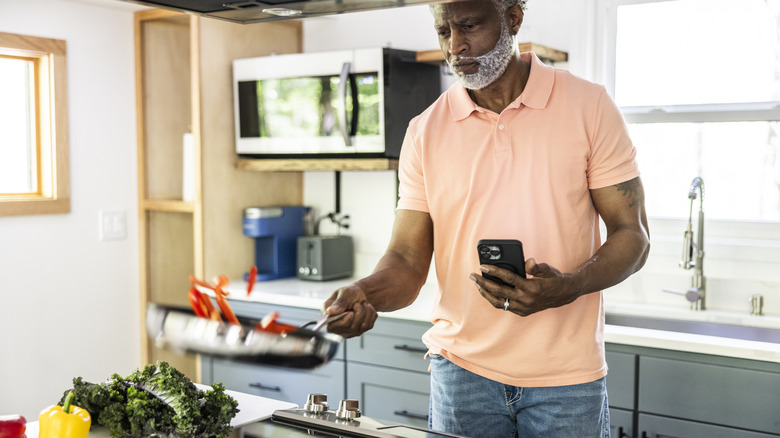 Older man cooking