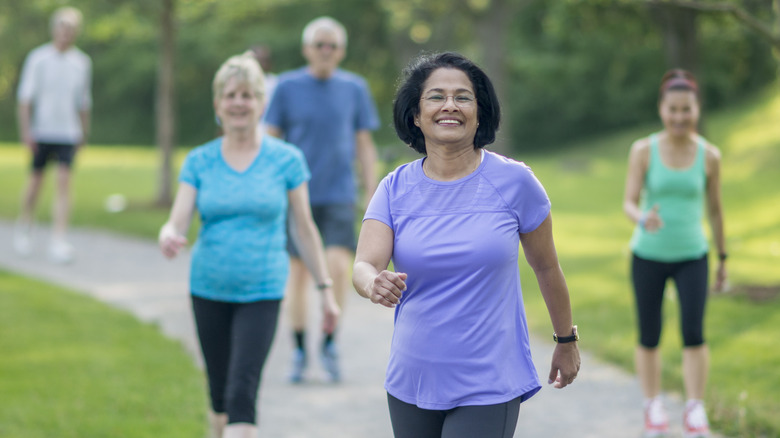 older adults walking in a park