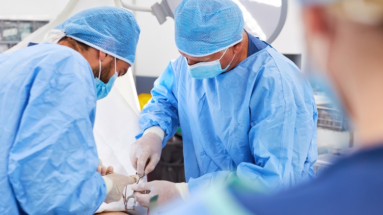 Doctors performing appendectomy 