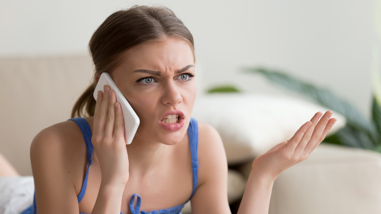 Angry woman talking on her cellphone