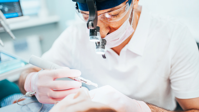 dentist working on a patient's tooth