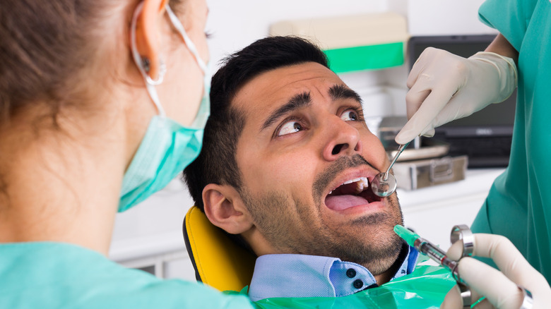 nervous man in dentist chair