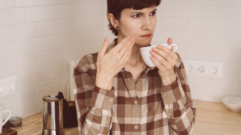 Woman experiencing a partial loss of taste