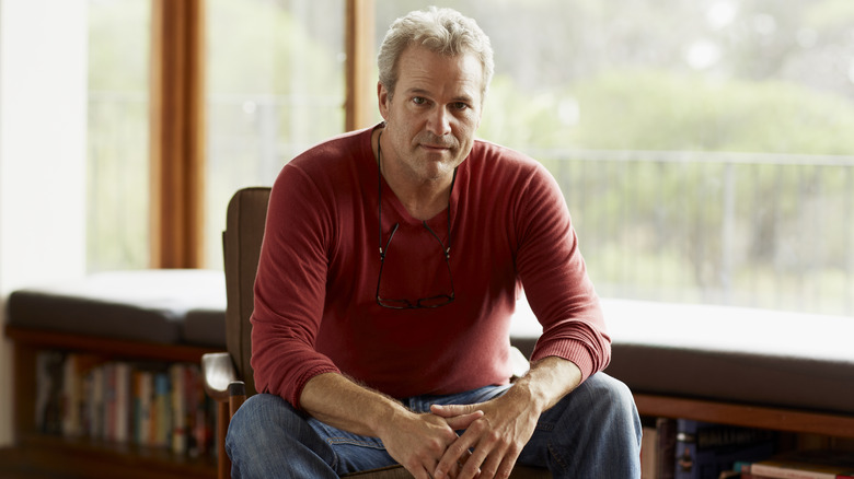 middle-aged man sitting on a chair