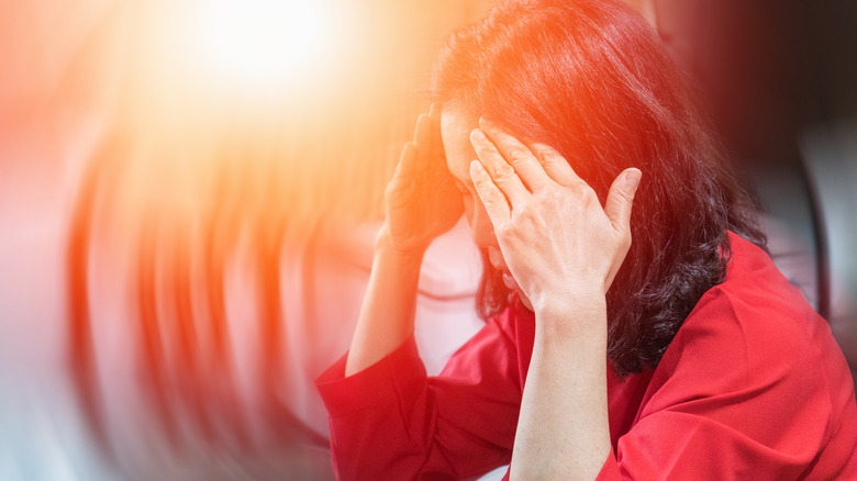 woman experiencing dizziness and vertigo