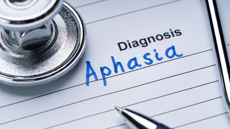 Paper that says "Diagnosis Aphasia" by stethoscope