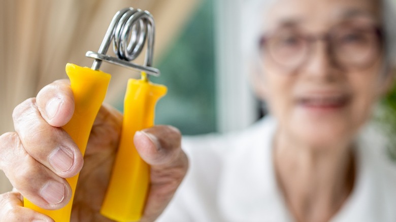 Senior woman exercising grip strength