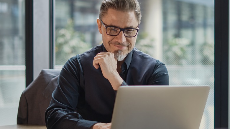 middle aged man using laptop