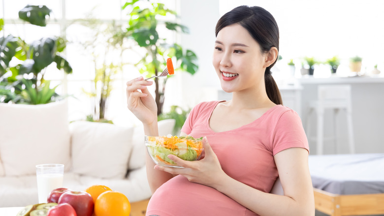 Pregnant woman eating