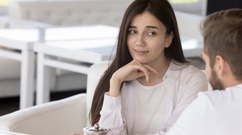Individual looking bored with date