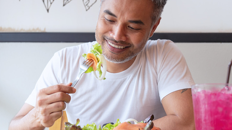 Man eating salmon