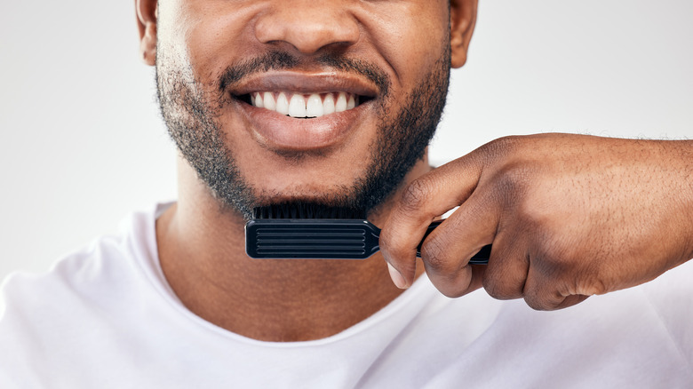 Man combing beard