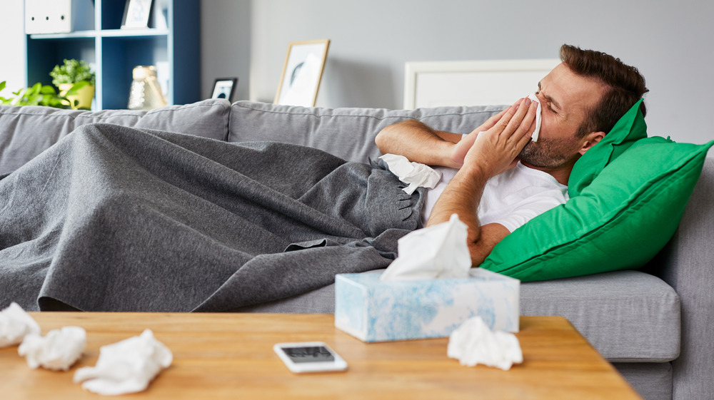 Person sick on the couch